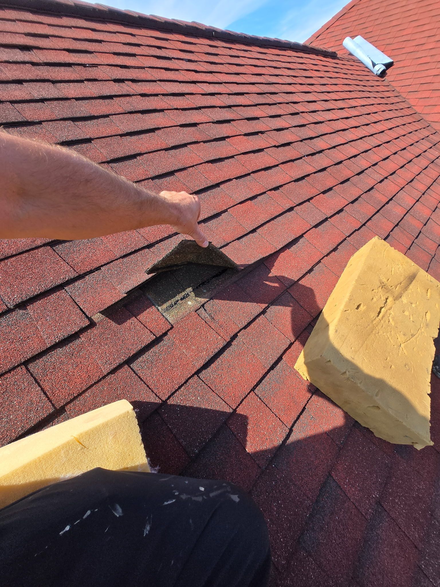 Damaged roof on a Langhorne, PA home being inspected for an insurance claim