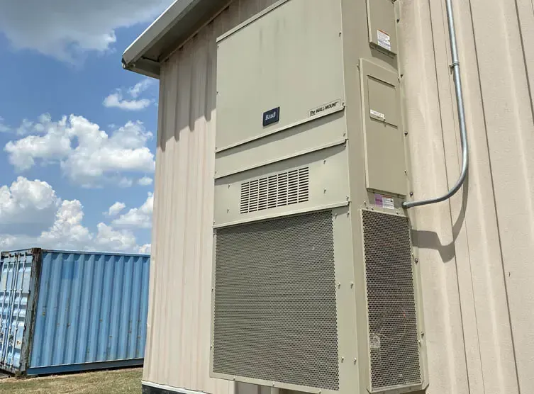 Bard air conditioner unit operating in a telecom shelter during Canadian winter