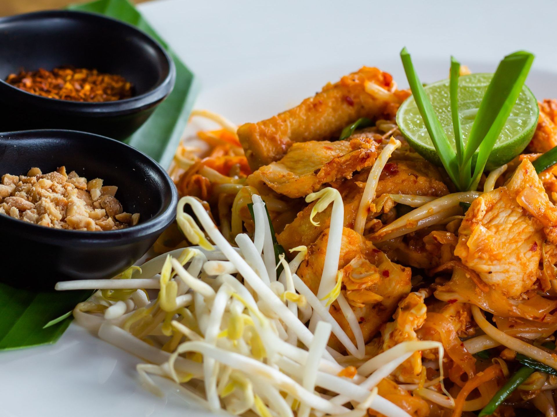 Front Eats restaurant online ordering customer success Thai Heaven spicy chicken with bean sprouts and spices on white plate