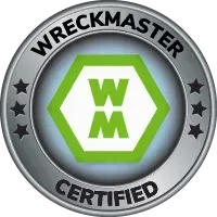 WreckMaster Certified badge with green WM logo in a silver circular emblem