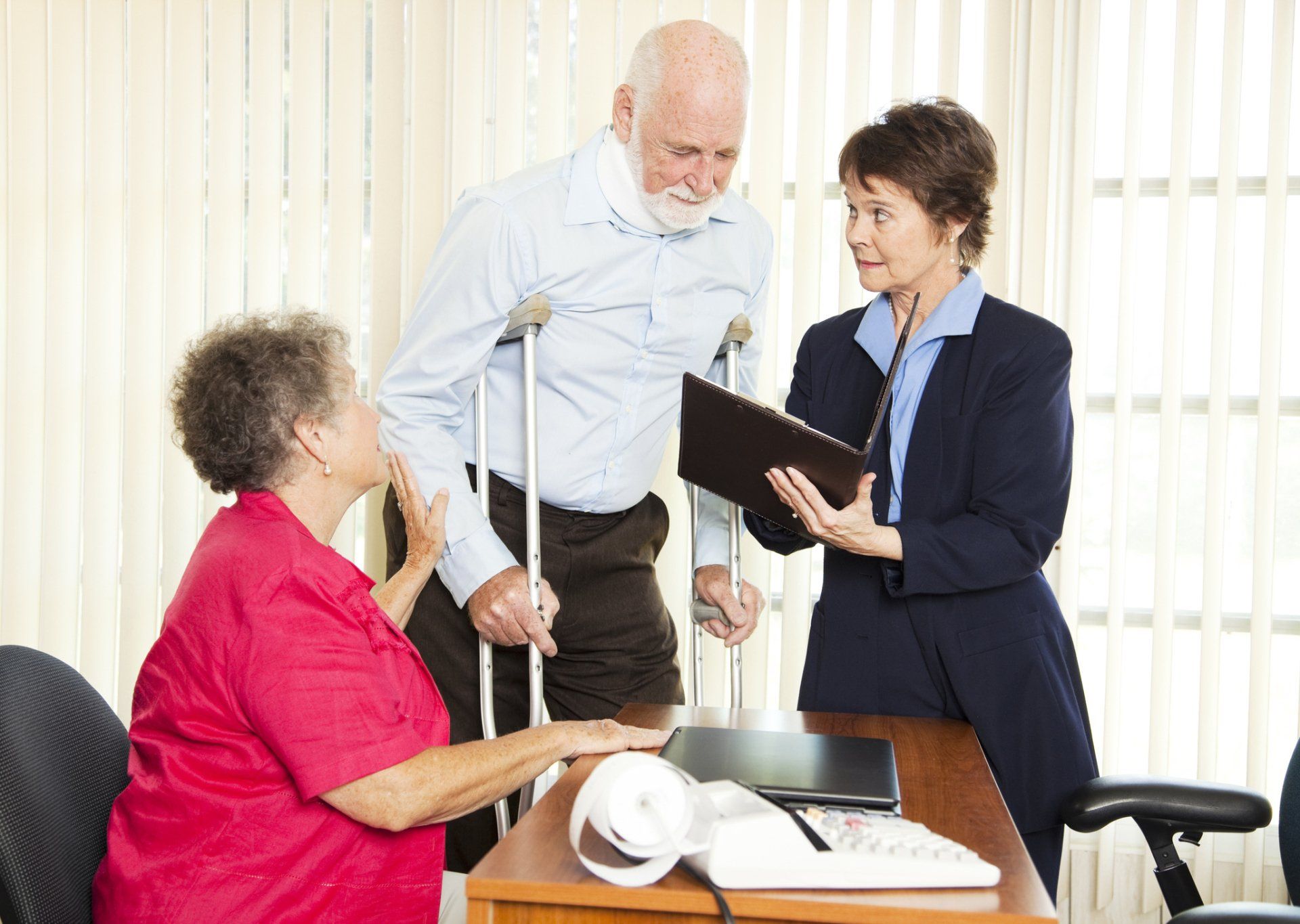 An Injured Man Getting Help — Utica, NY — Murad And Murad, P.C.