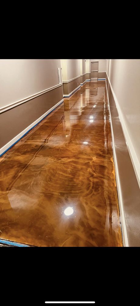 Glossy polished hallway with brown marble floor and beige walls
