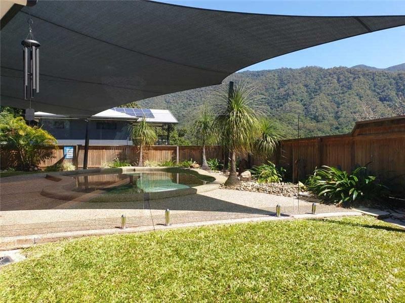 A Backyard With A Swimming Pool And Mountains — Style Shades Installation In Edmonton, QLD