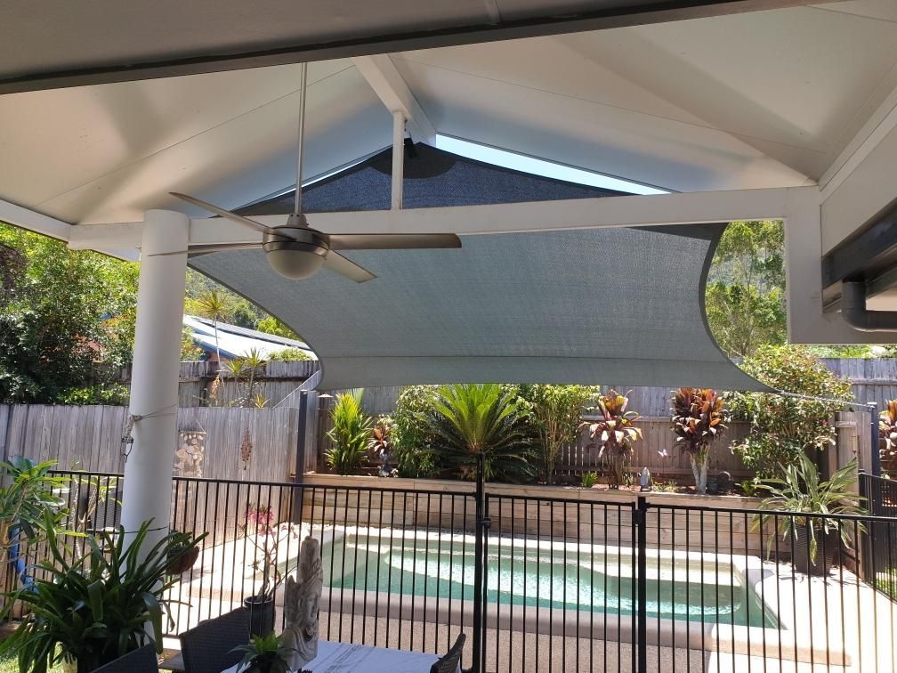 A Patio With A Ceiling Fan And A Pool In The Background — Style Shades Installation In Atherton Tablelands, QLD