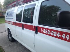 A-24 Hour Door America white service van.