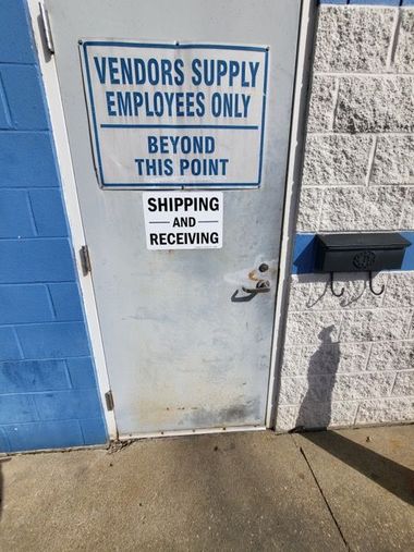 Metal door with Vendors Supply Employees Only sign. 