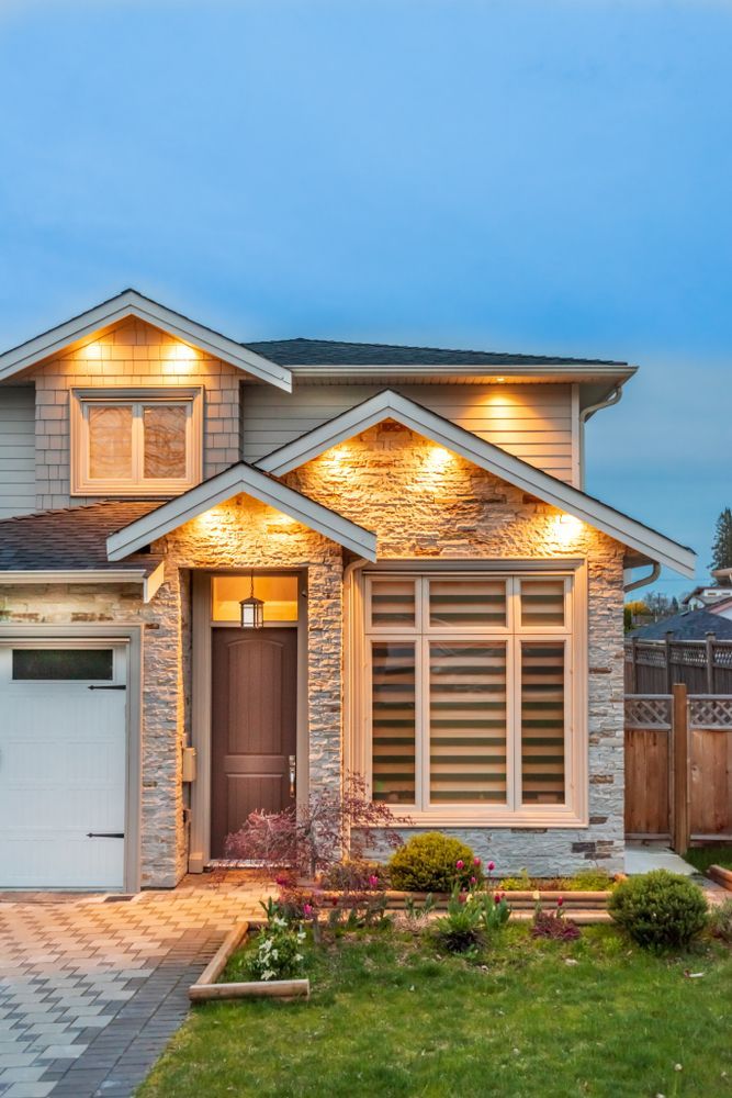 Two-Story House With Stone Facade — Peterson Property Valuations Brisbane in Southern M1 Gold Coast, QLD