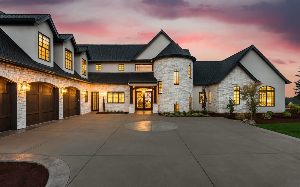 Large White Stone House With a Black Roof — Peterson Property Valuations Brisbane in Brisbane West, QLD