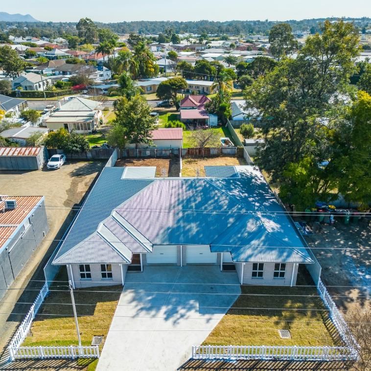 An Aerial View of A House with A Blue Roof — Jonobilt in Newcastle, NSW