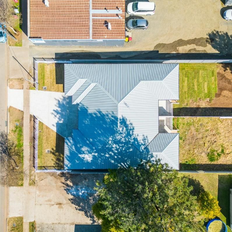 An Aerial View of A House with A Gray Roof — Jonobilt in Cameron Park, NSW