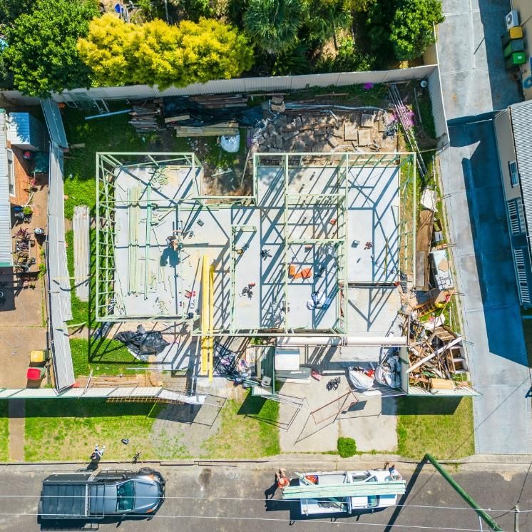 An Aerial View of A Building Under Construction with A Truck Parked in Front of It — Jonobilt in Cessnock, NSW