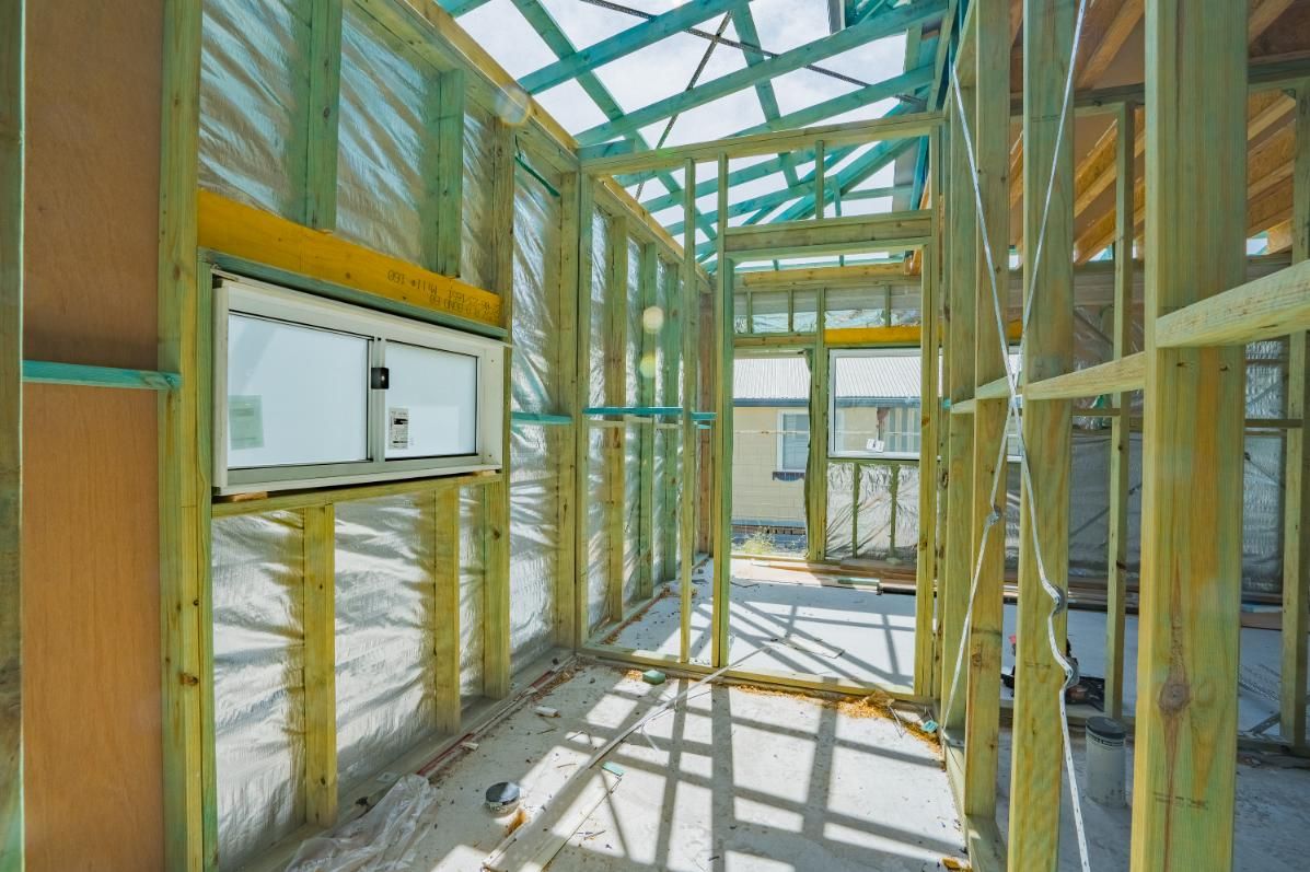 A House Is Being Built with Wooden Beams and A Roof — Jonobilt in Caves Beach, NSW