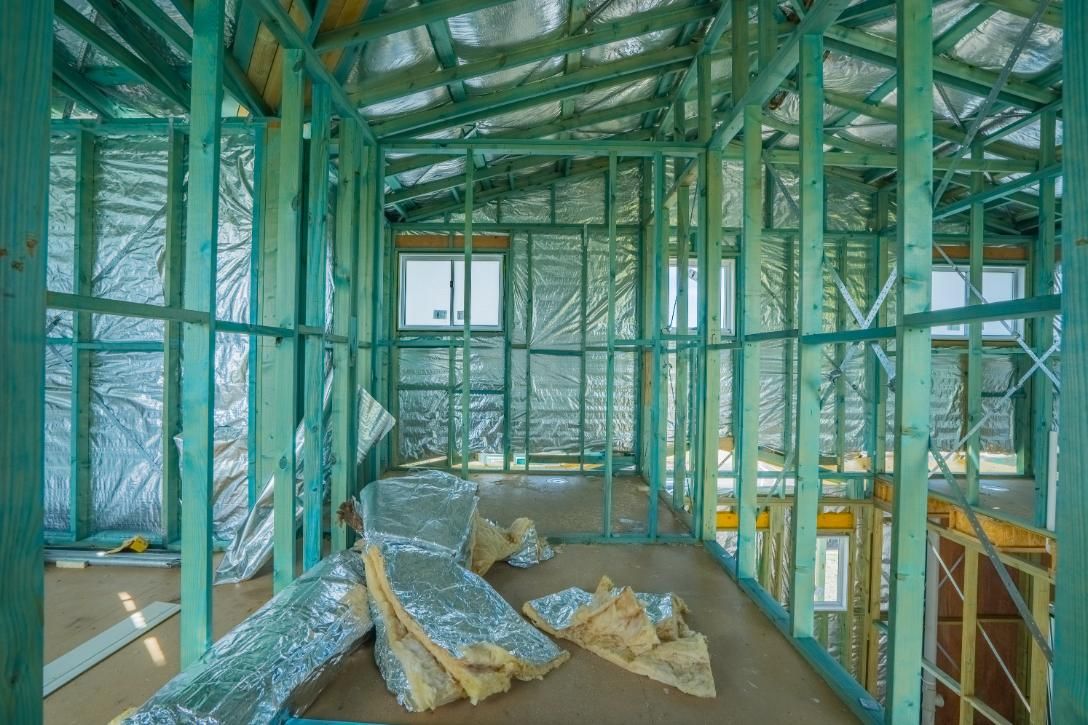 The Inside of A Building Under Construction with A Lot of Insulation — Jonobilt in Warners Bay, NSW