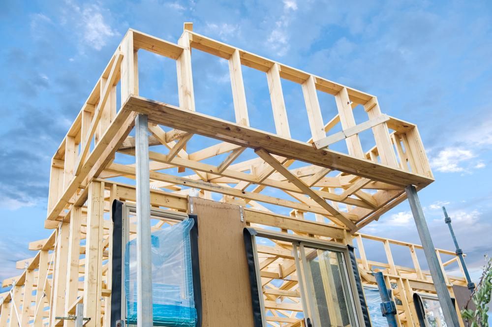 A Wooden House Is Being Built with A Blue Sky in The Background — Jonobilt in Redhead, NSW