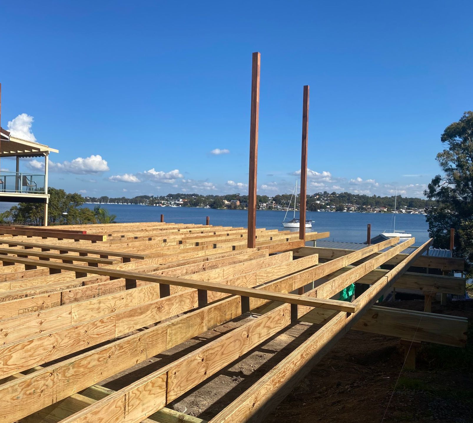A Wooden Deck Frame is overlooking waterfront — Jonobilt in Bolwarra, NSW