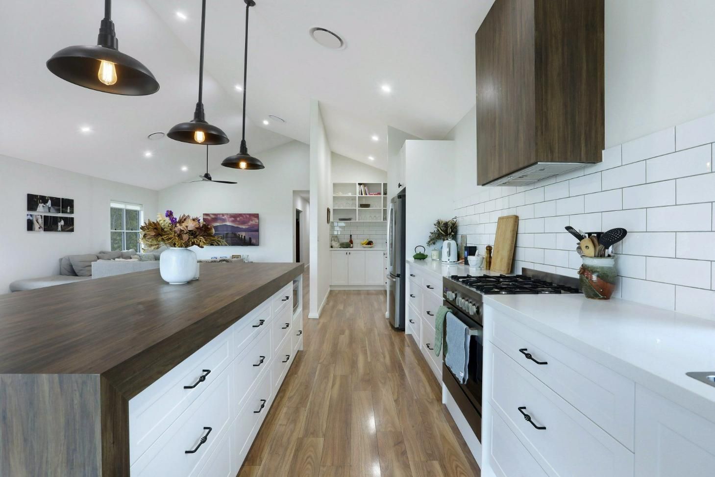A Kitchen with White Cabinets and Wooden Counter Tops — Jonobilt in Bolwarra, NSW
