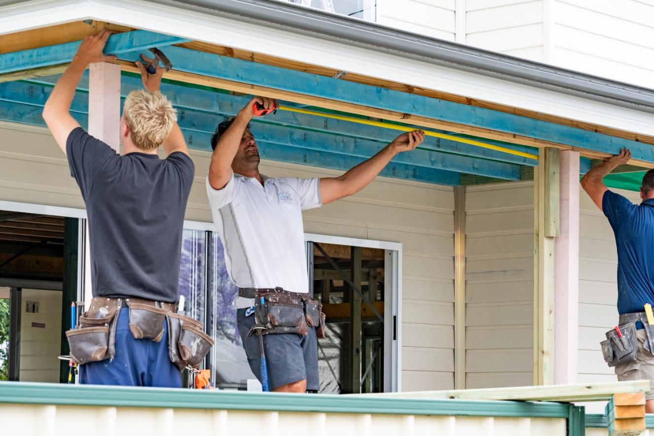 A Group of Men Are Working on A Porch of A House — Jonobilt in Singleton, NSW