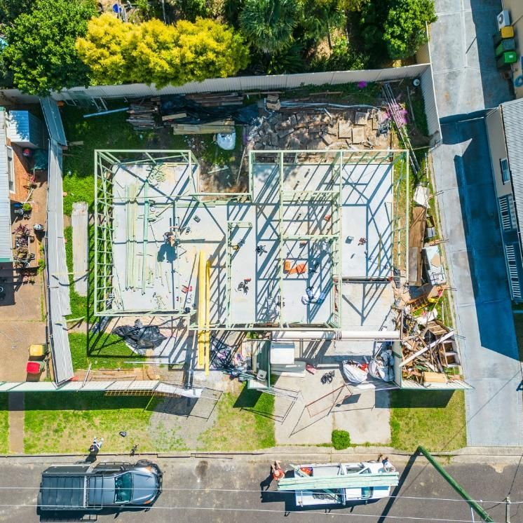 An Aerial View of A Building Under Construction with A Truck Parked in Front of It — Jonobilt in Bolwarra, NSW