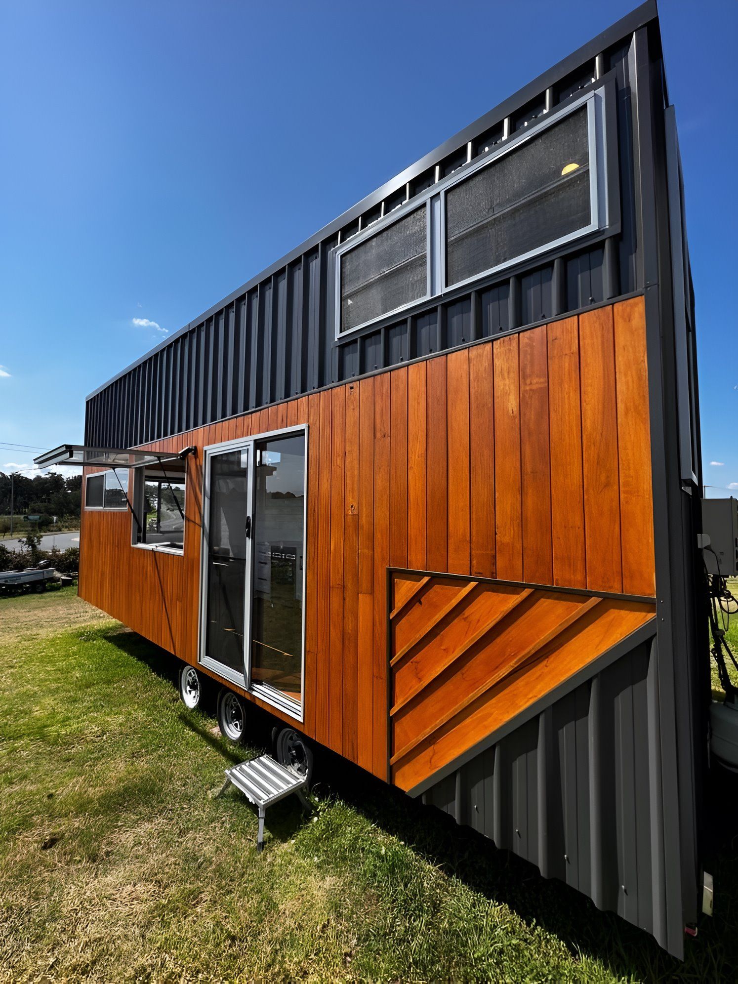 A Tiny House is Sitting in the Middle of a Grassy Field — Jonobilt in Bolwarra, NSW