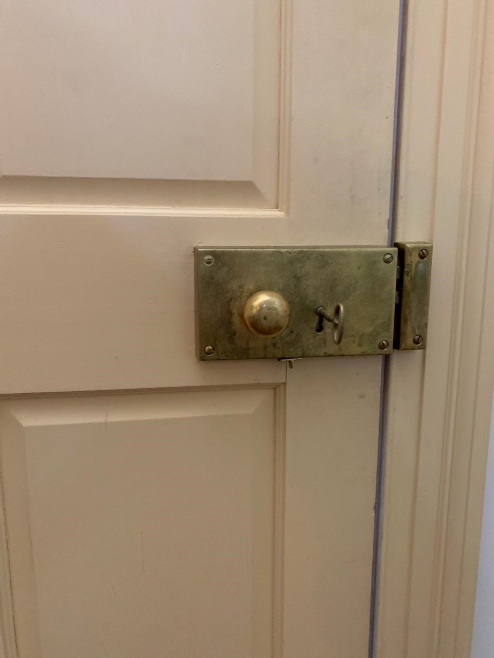 A close up of a door with a lock on it.