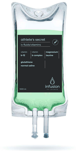 A bag of infusion juice with two syringes attached to it.