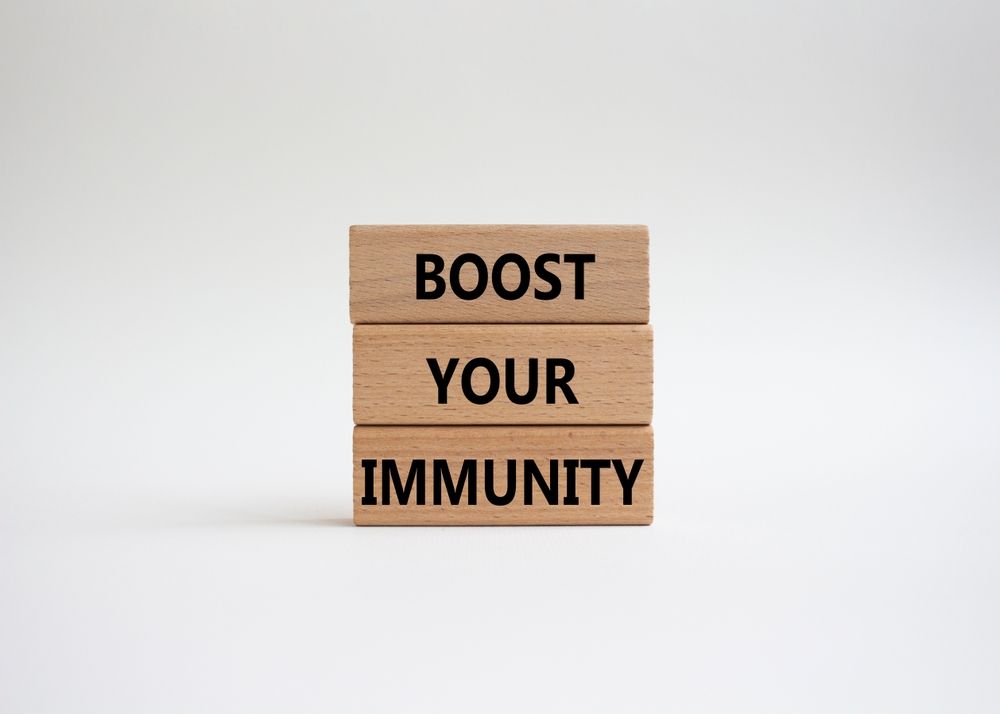 A stack of wooden blocks with the words `` boost your immunity '' written on them.