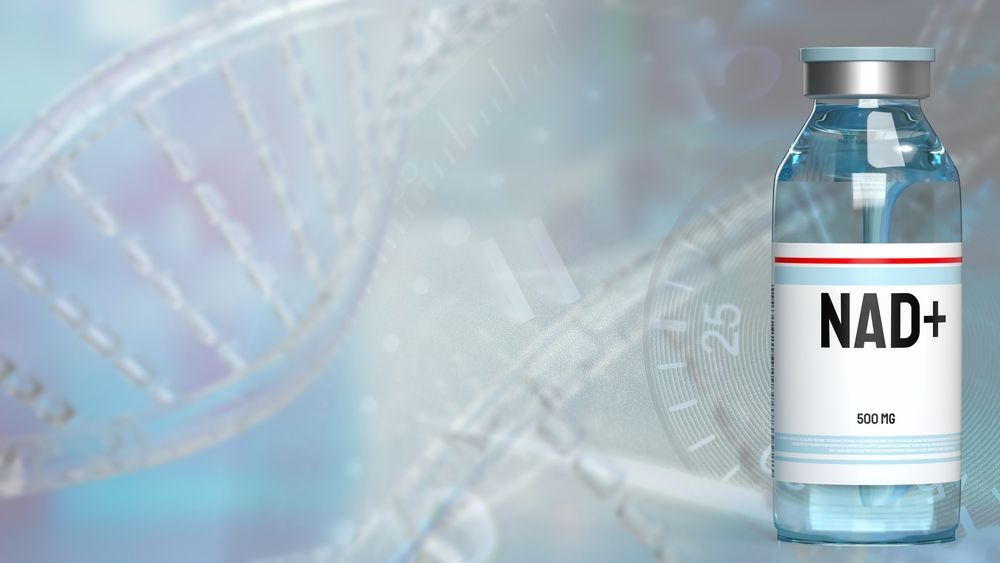 A bottle of nad + in front of a dna structure.