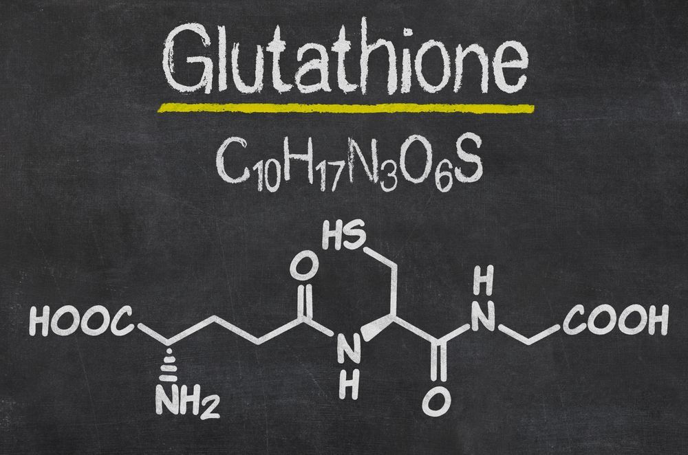 The chemical structure of glutathione is shown on a blackboard