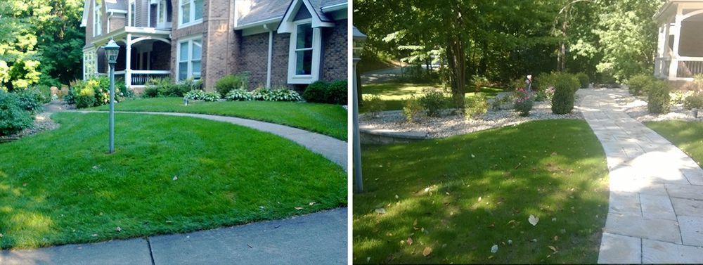 Two houses with green lawns and walkways.
