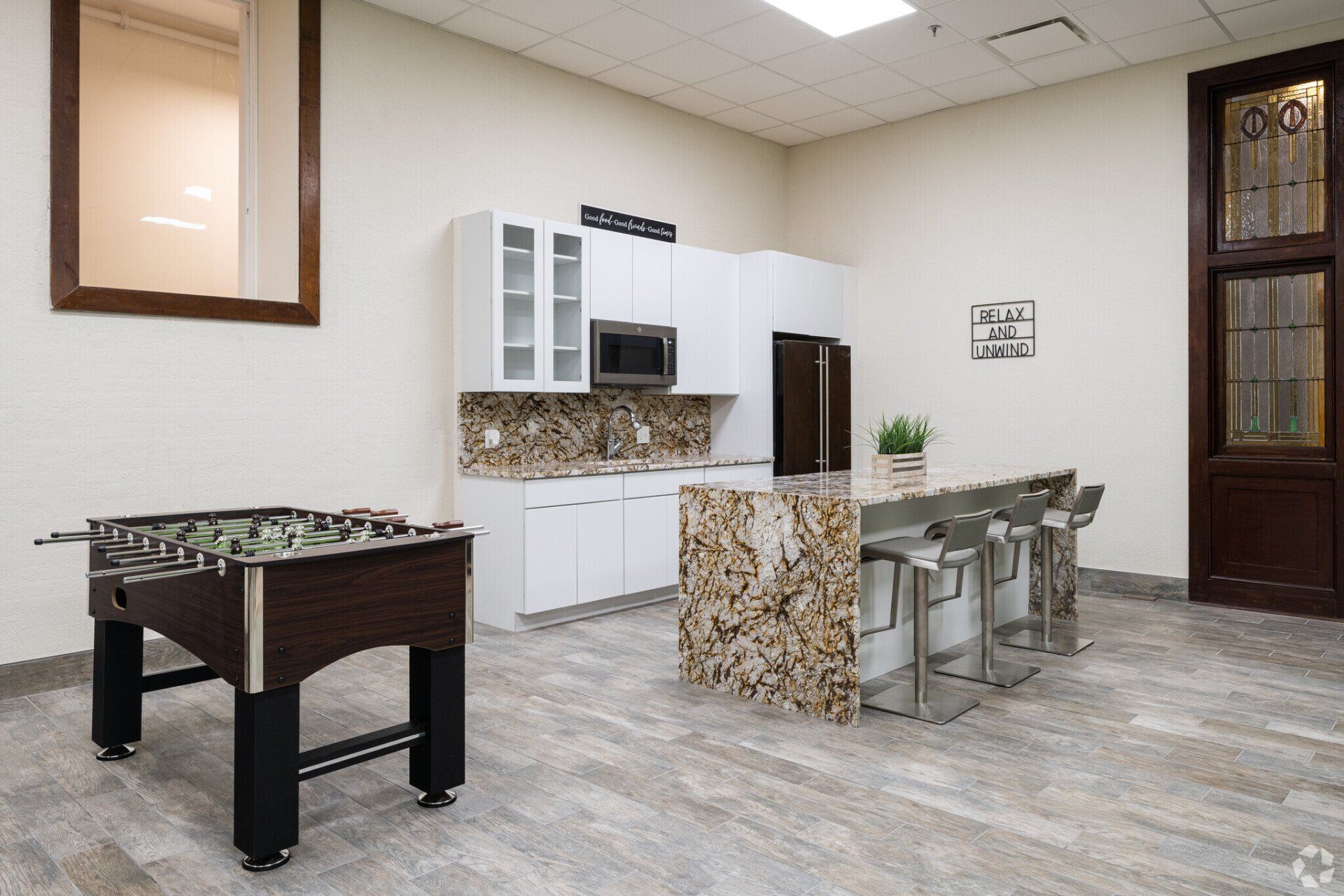 Community lounge with games and kitchen
