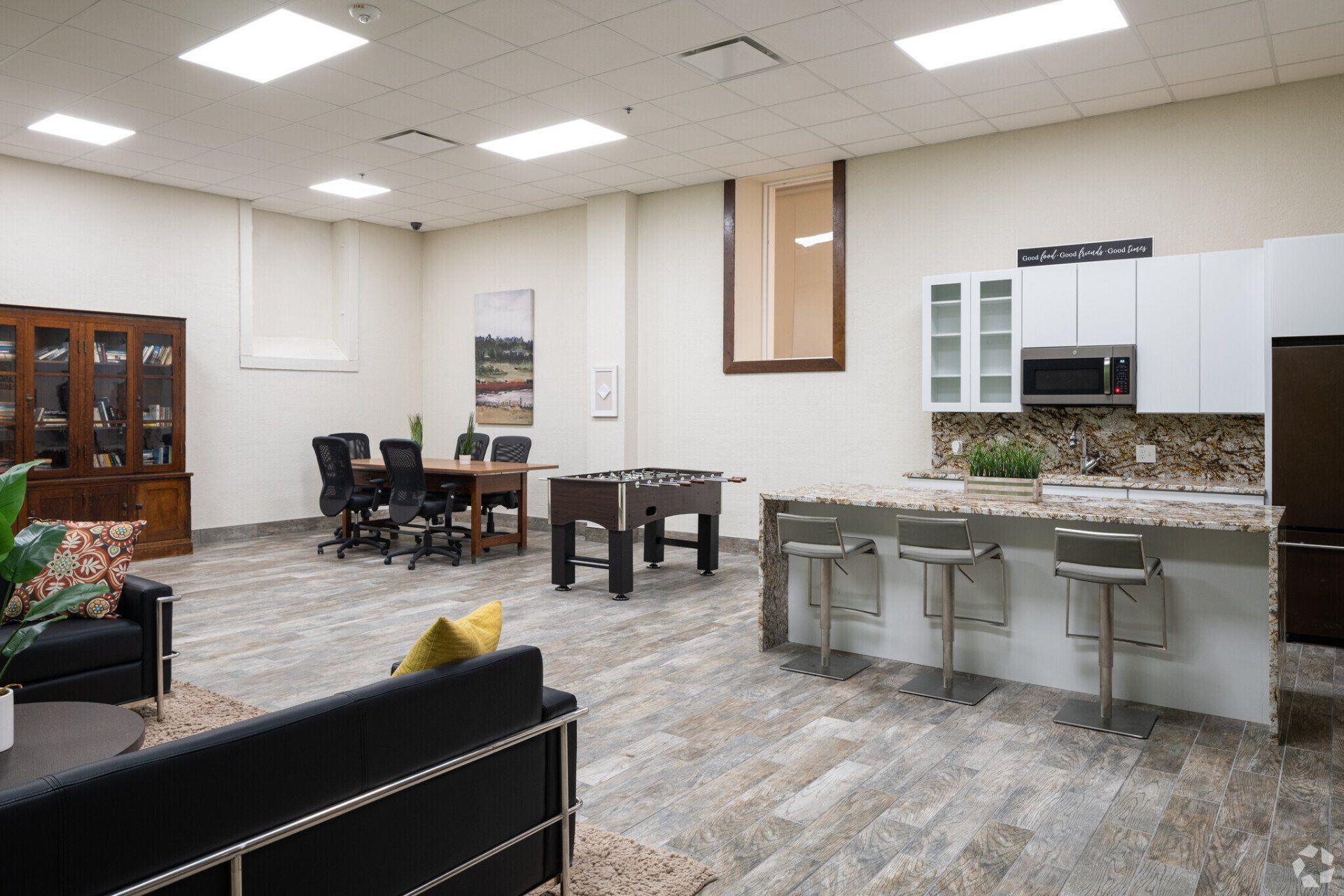 Community lounge with games and kitchen