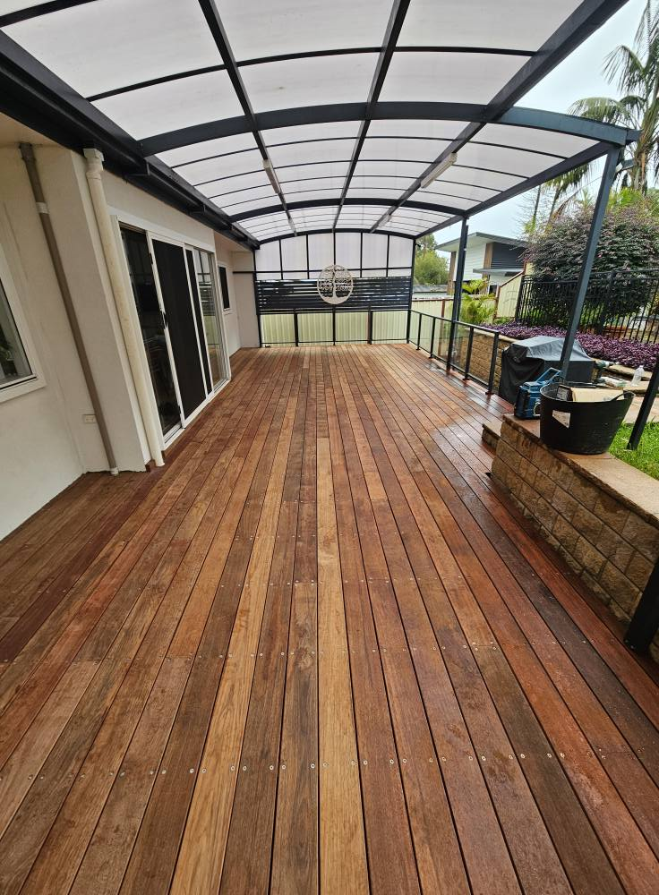 A large wooden deck with a canopy over it.