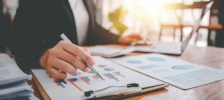 A person looking at financial charts