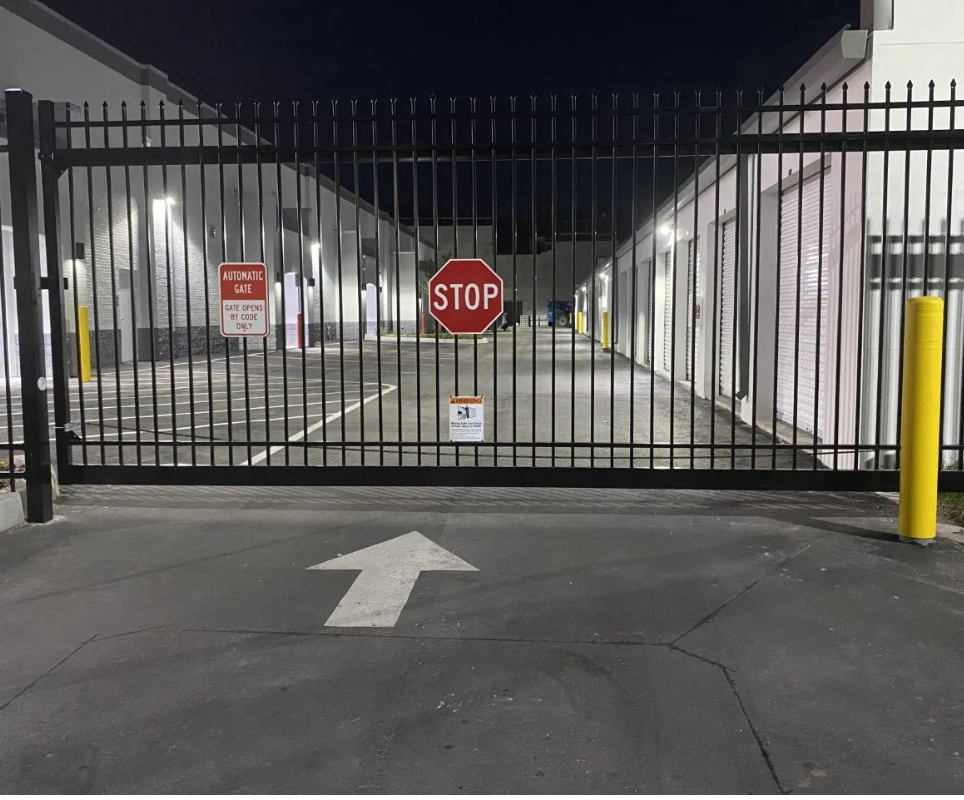 A sliding gate with a stop sign on it