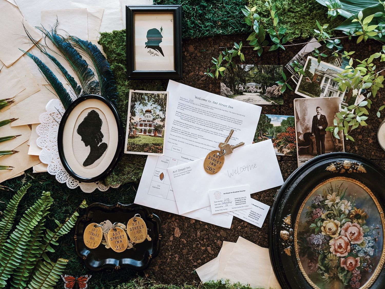 A collage of pictures , letters , and a key on a table.