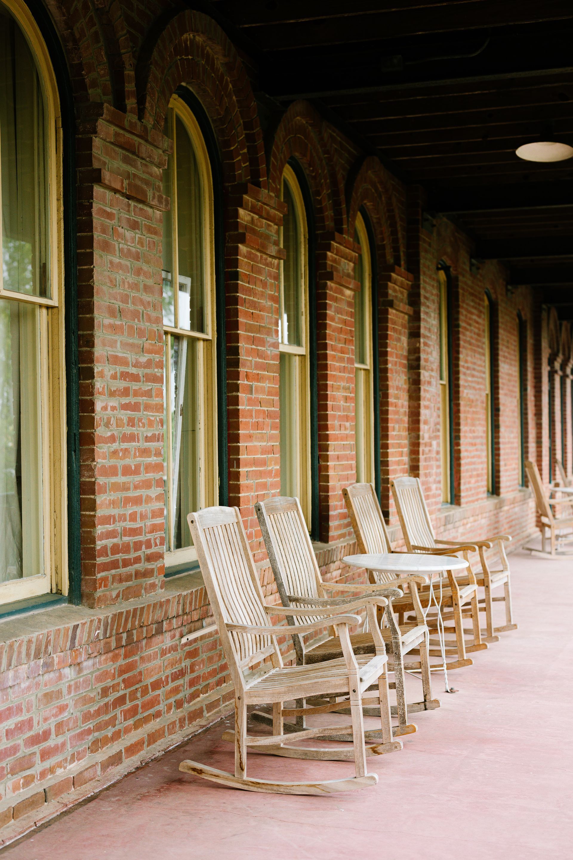 rocking chairs on a historic veranda building