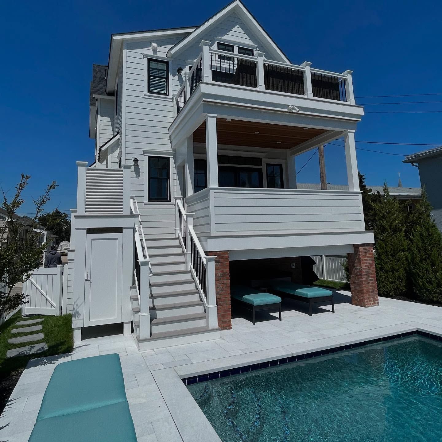 White beach house with pool, deck, and stairs built by j.k. construction llc in sea isle city, nj
