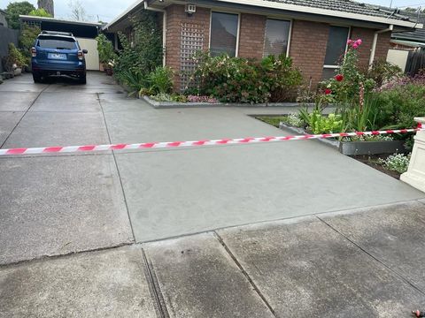 Concreters constructing a concrete floor for a home property in Melton VIC.