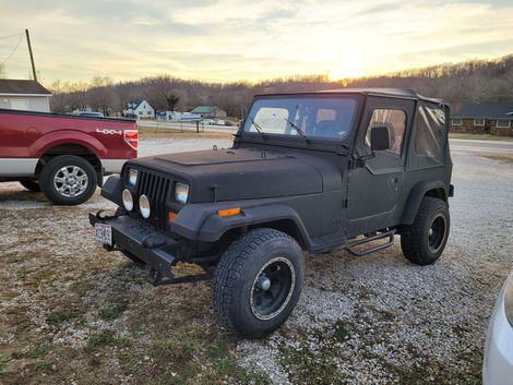 Black Jeep parked outdoors | Mr. Fix It Auto Repair