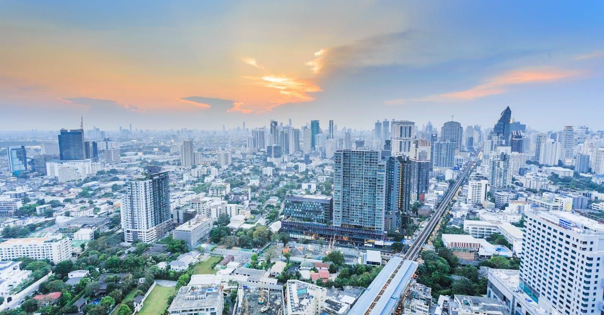 An aerial view of a city skyline at sunset.
