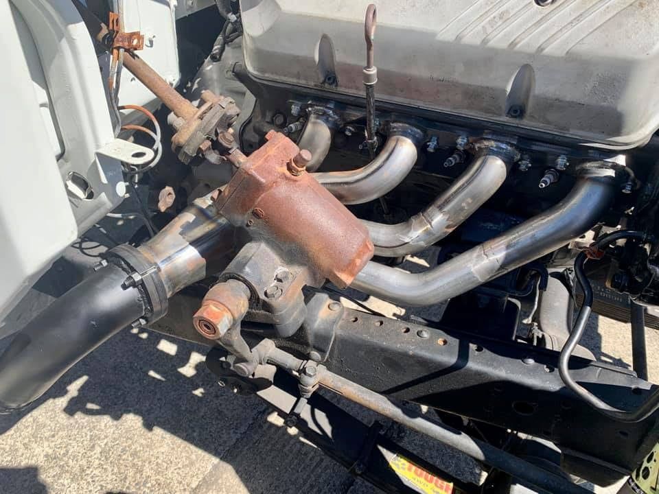 A Close Up Of A Car Engine With Exhaust Pipes — Hannam Street Mufflers and Mechanical In Bungalow, QLD