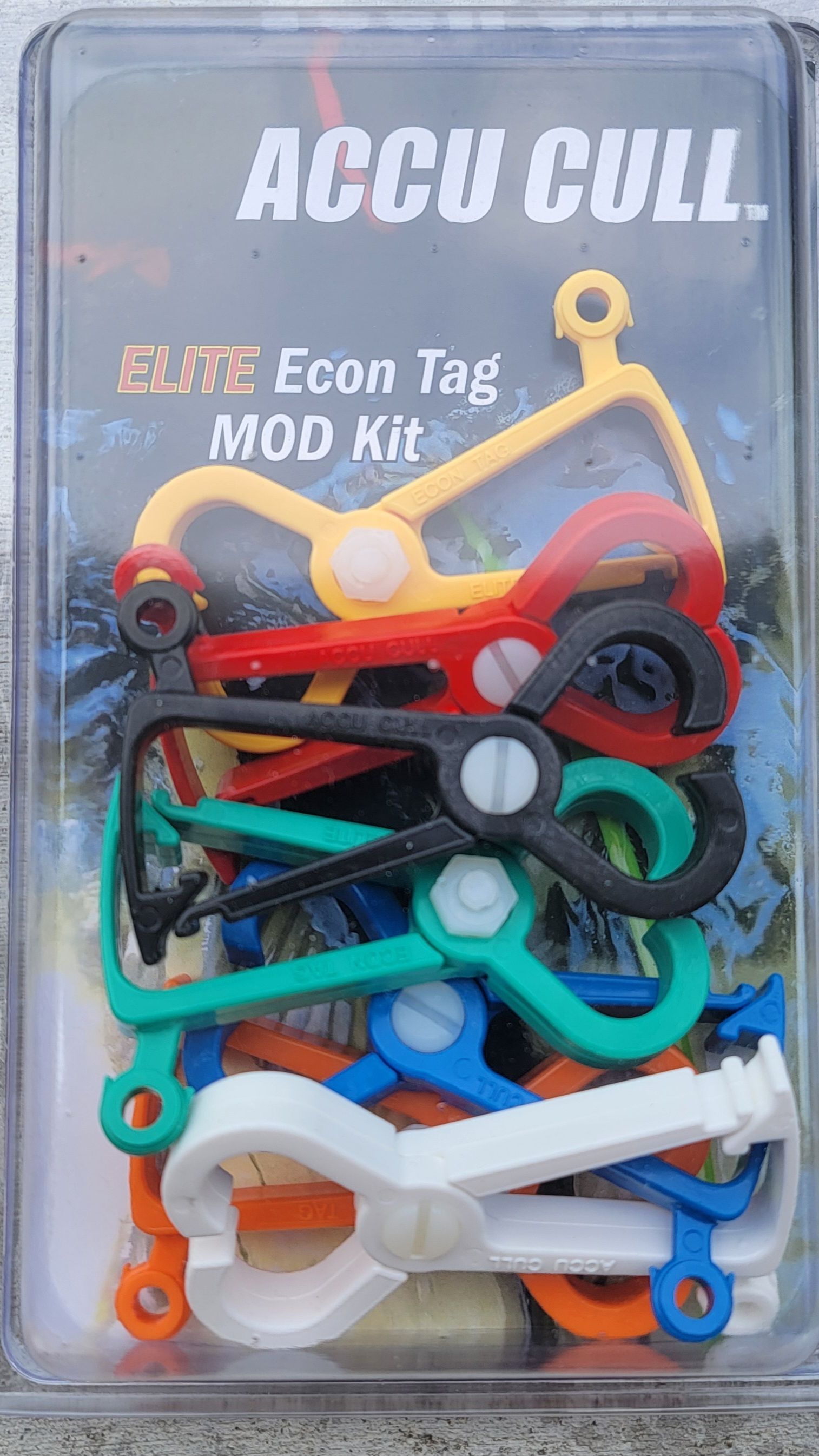 A package of colorful scissors in the shape of a heart on a table.