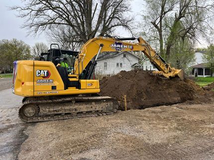 Yellow tractor Preparing soil - Springfield, IL - Jaren Industries Yellow tractor Preparing soil - Springfield, IL - Jaren Industries