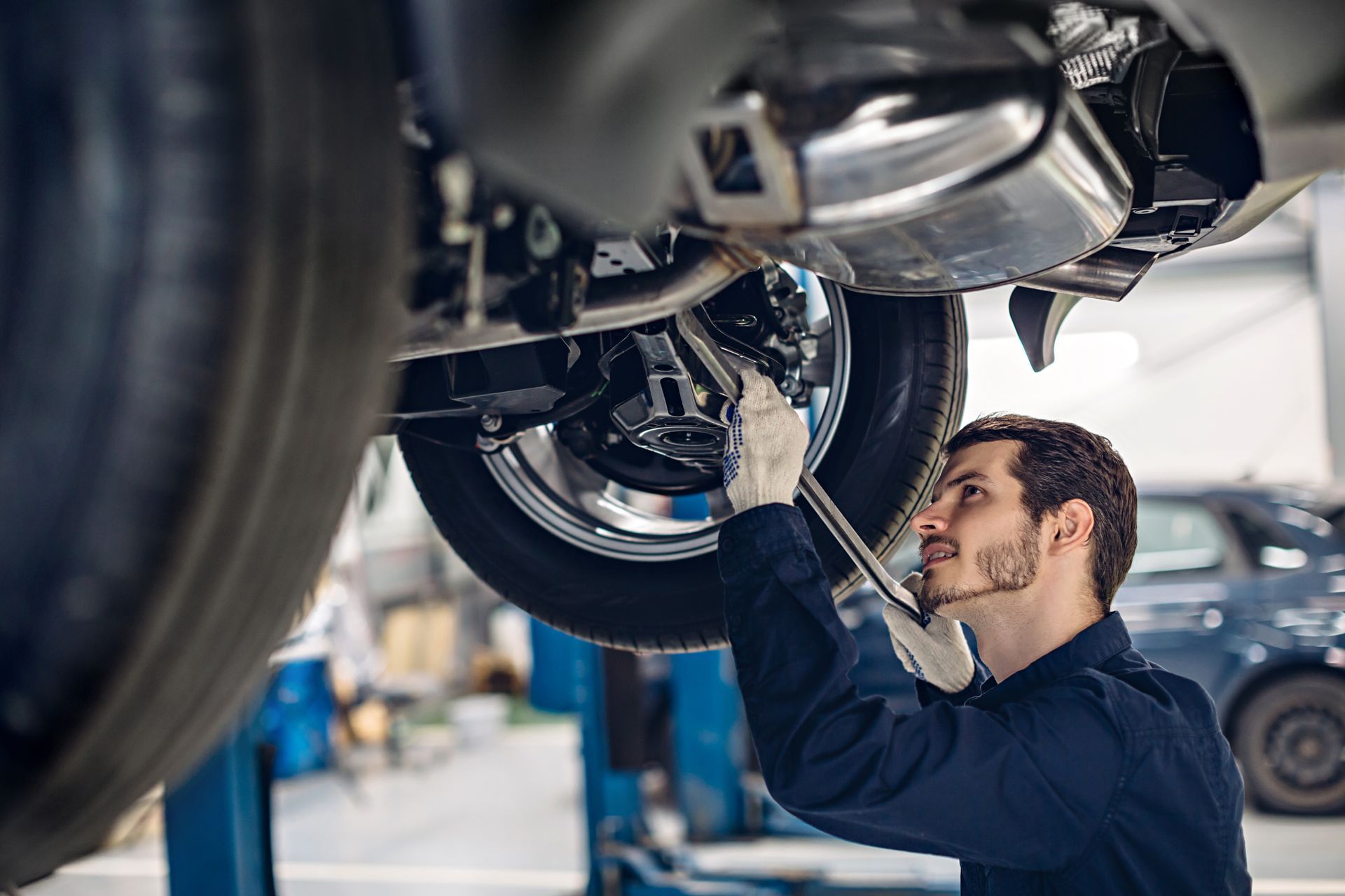 Skilled technician performing routine maintenance and diagnostics at a local auto repair shop.