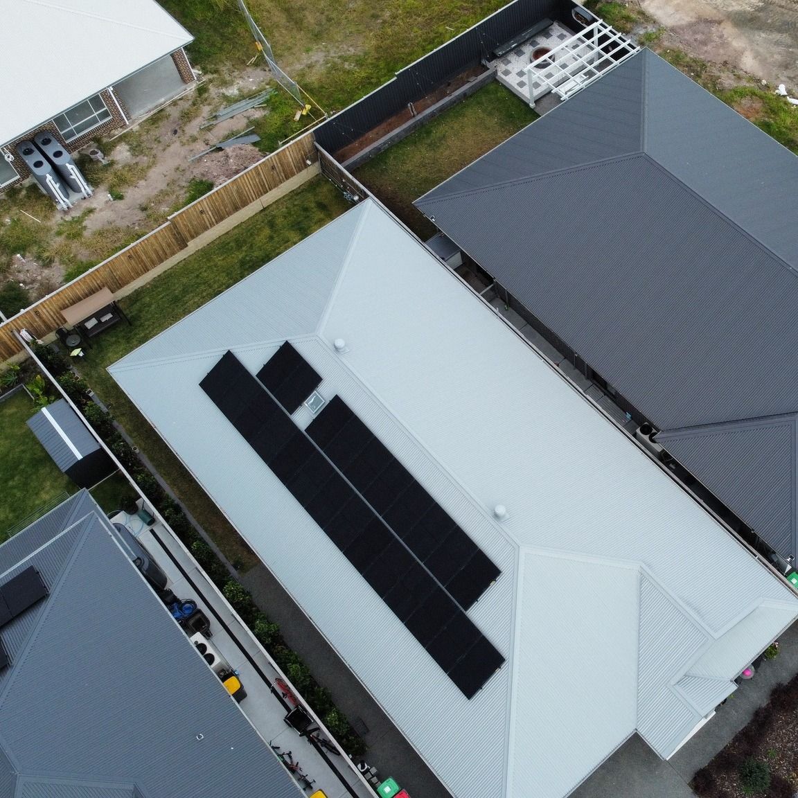 An Aerial View of A House with Solar Panels on The Roof — Podium Solar in Cameron Park, NSW
