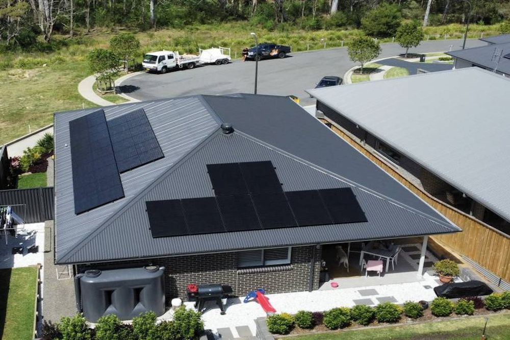 A Man Is Working on A Solar Panel — Podium Solar in Cameron Park, NSW