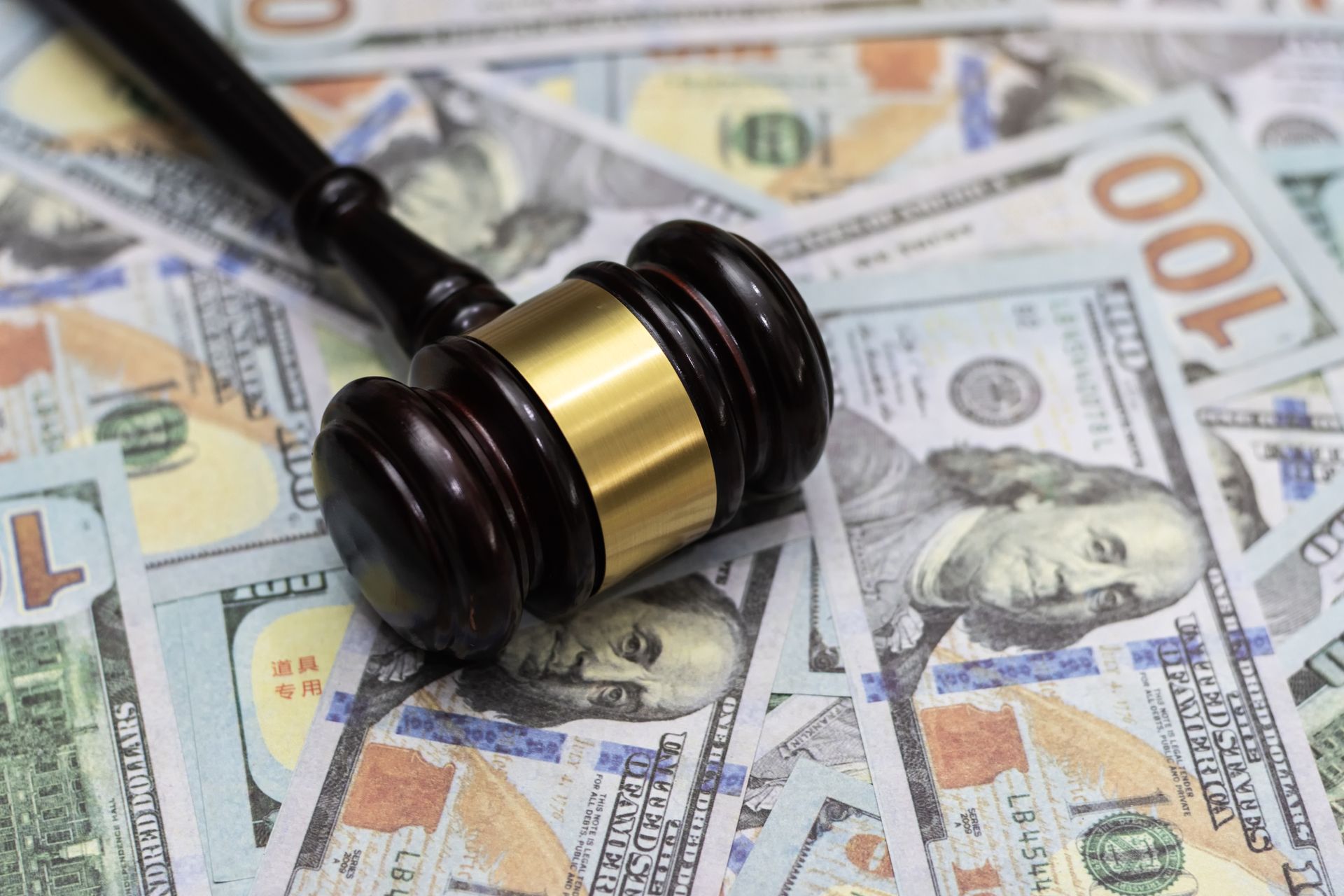 Wooden Gavel and Dollar Banknotes - Pasco Country, FL - Brads Bail Bonds