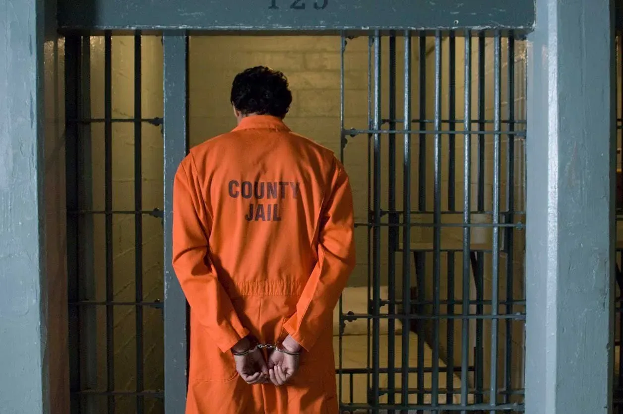Man In Orange Prison Uniform — New Port Richey, FL — Brad’s Bail Bonds Man In Orange Prison Uniform — New Port Richey, FL — Brad’s Bail Bonds
