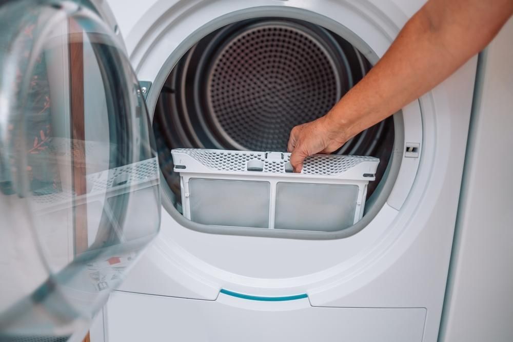 A Person is Fixing a Washing Machine With Their Hands — A.S.A.P. Appliance Service & Sales in Hamlyn Terrace, NSW