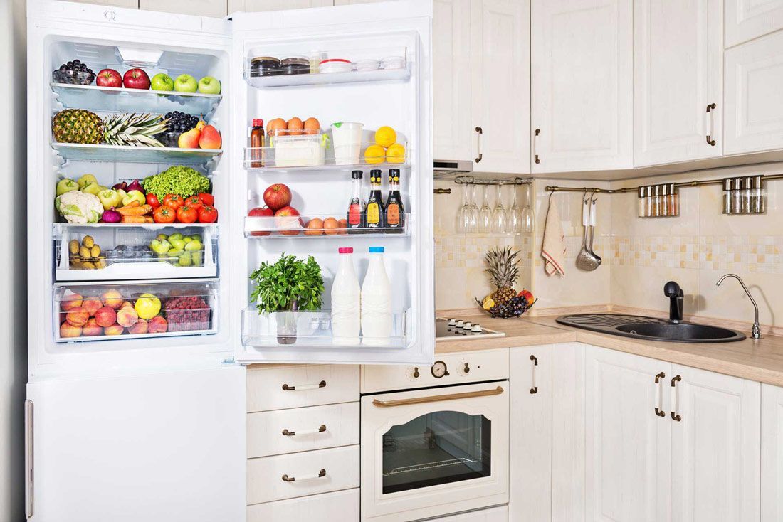 A Kitchen With a Refrigerator Filled With Fruits and Vegetables — A.S.A.P. Appliance Service & Sales in Lake Macquarie, NSW